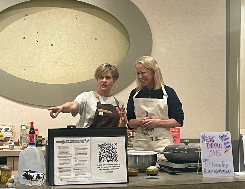 Jodi does a cooking demo with Representative Kelly Morrison at the Eden Prairie Eco-Fair